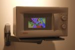 A slowly-rotating, generative video installed in a microwave.